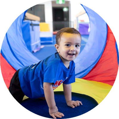 Toddler enjoying casual gym play at the Y